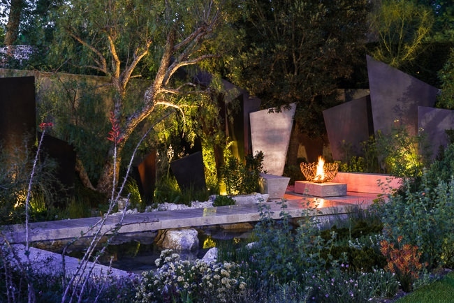 Fire basket in a contemporary garden in the evening