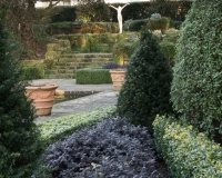 Statue of a woman with outstretched arms in the Italianate garden