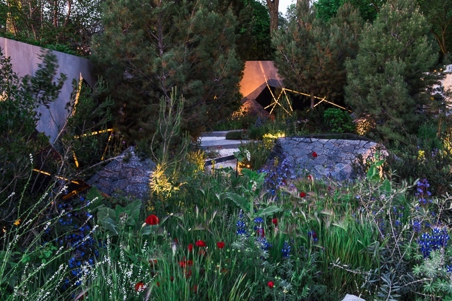 Lighting geometric shapes and basalt mounds in a contemporary mediterranean garden