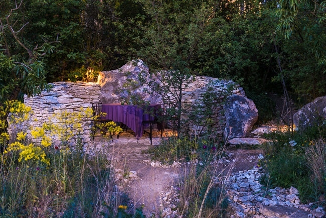 Lighting in a mediterranean style garden early evening