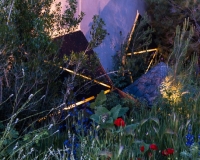 Lighting geometric shapes and basalt mounds in a contemporary mediterranean garden