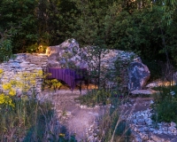Lighting in a mediterranean style garden early evening