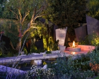 Fire basket in a contemporary garden in the evening